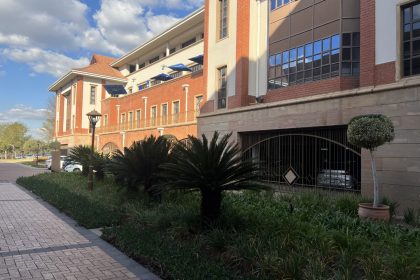 Outside shot of The Roland Garos building parking area